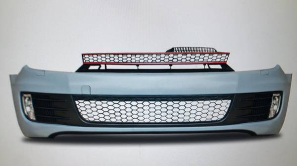 Front bumper in sports design with grill and fog  lights suitabl